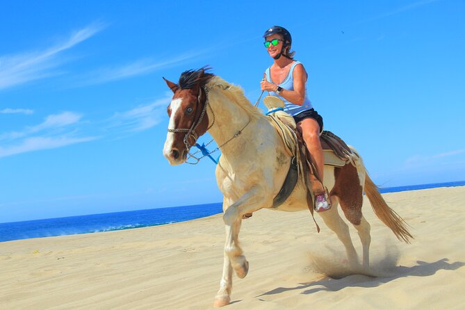 Cabo Shore Excursion: Beach Horseback Ride & Tequila Tasting - Riding through cactus country toward Playa Migrino