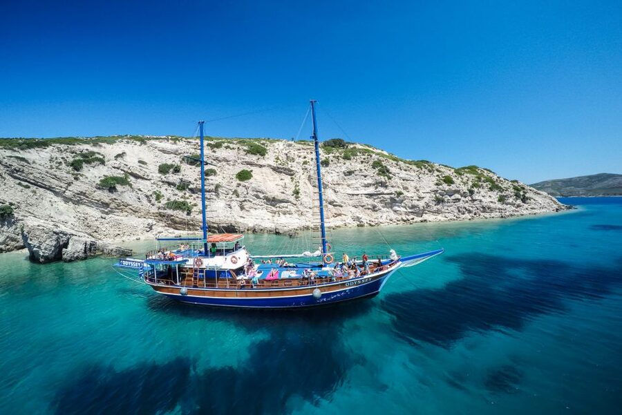 From the Port of Kos: Full Day Boat Cruise to 3 Islands - Watching for dolphins near the fish farms