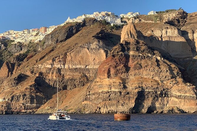 Private Luxury Santorini Catamaran Cruise with Port Pickup - The onboard Greek meal is more than a snack