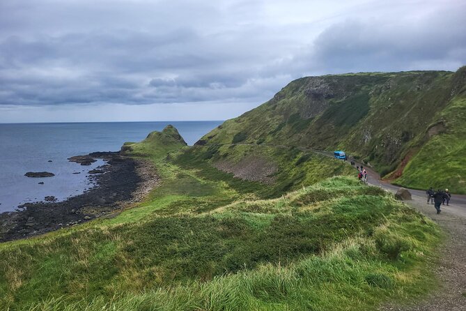 Shore Excursion from Belfast to Giants Causeway & Rope Bridge - Dunluce Castle hangs above the sea